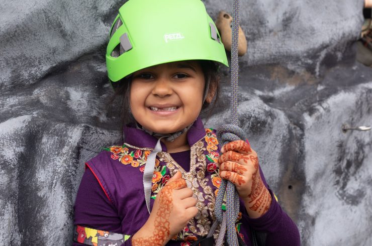 Zynab age 7 rock climbing at Playday at Eureka!